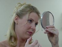 Looking for Problems  Sheri looks for any untame eyebrow hairs or ugly pimples!!!